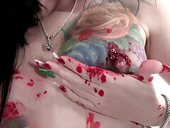 Inked honey Marie Bossette glazes herself in hot wax