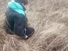 She pissed under a tree. Piss pouring out of pussy