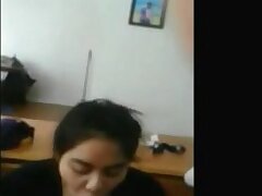 Japanese girl jerks dark-hued spear