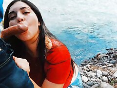 Risky sultry fellatio in nature outdoors.