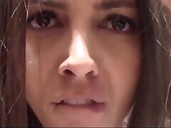 Brunette makes a selfie in the store switching bedrooms