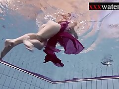 Smoking hot Russian redhead in the pool